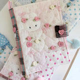 Elevate your journaling experience with these soft and cozy journal covers, designed to protect and personalize your daily diary. Each cover features beautiful blue and pink patterned fabric with thoughtfully sewn details and a secure metal button clasp to keep your pages safe. Includes matching ribbon bookmarks for easy navigation. Available in both A5 and A6 sizes to fit your preferred journal dimensions. The perfect companion for your daily routine and creative practice.