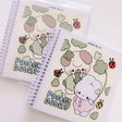 Cozy Creativity Anywhere with the Atelier by Jo Pocket Coloring Book! ✨

Bring Cotton and Pluto along on your everyday adventures with this adorable Pocket Coloring Book featuring simple and cozy Atelier by Jo character pages! Filled with 20 original illustrations in a compact 4 x 5 inch format, this spiral-bound mini coloring book is designed for relaxing, stress-free coloring anytime and anywhere.

Featuring sweet character moments, cute everyday scenes, and easy-to-color designs, this collection is perfe