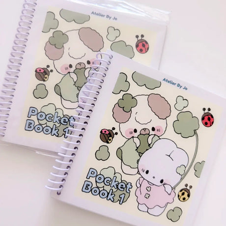 Cozy Creativity Anywhere with the Atelier by Jo Pocket Coloring Book! ✨

Bring Cotton and Pluto along on your everyday adventures with this adorable Pocket Coloring Book featuring simple and cozy Atelier by Jo character pages! Filled with 20 original illustrations in a compact 4 x 5 inch format, this spiral-bound mini coloring book is designed for relaxing, stress-free coloring anytime and anywhere.

Featuring sweet character moments, cute everyday scenes, and easy-to-color designs, this collection is perfe