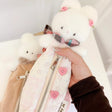 Atelier by Jo Soft Pink Pencil Pouch

Keep all your journaling essentials organized in one adorable pouch. This soft pink pencil case features charming Cotton the bunny button accessories, perfect for holding pens, pencils, markers, tape, rulers, and more. The gentle fabric and cute design make it an ideal companion for your creative projects and daily planning.