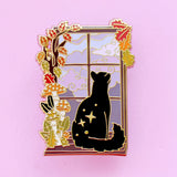 There’s nothing quite like staying indoors cosy whilst a storm rages outside! This evocative enamel pin features a black cat looking out at pink stormy clouds, adorned by fall mushrooms and leaves. 

Made from gold hard enamel, the pin is secured by two pink backs and comes on a Glitter Punk backing card, making it perfect for a gift or to keep as a special treat for yourself.

Measurements: 45mm