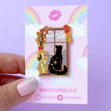 There’s nothing quite like staying indoors cosy whilst a storm rages outside! This evocative enamel pin features a black cat looking out at pink stormy clouds, adorned by fall mushrooms and leaves. 

Made from gold hard enamel, the pin is secured by two pink backs and comes on a Glitter Punk backing card, making it perfect for a gift or to keep as a special treat for yourself.

Measurements: 45mm