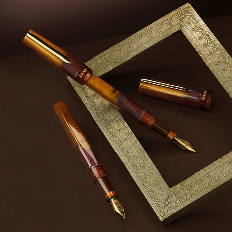 Unveil the world of refined writing with Decadence Haute, a distinguished offering from Luxury Brands of America. Designed for the discerning, this pen signifies more than just a writing tool; it's a testament to the artistry, heritage, and functionality that our brand epitomizes. Each stroke reflects the careful selection and passion for craftsmanship that sets us apart. From the boardroom to the study, Decadence Haute delivers an unparalleled writing experience, marking your unique story and inspiring you