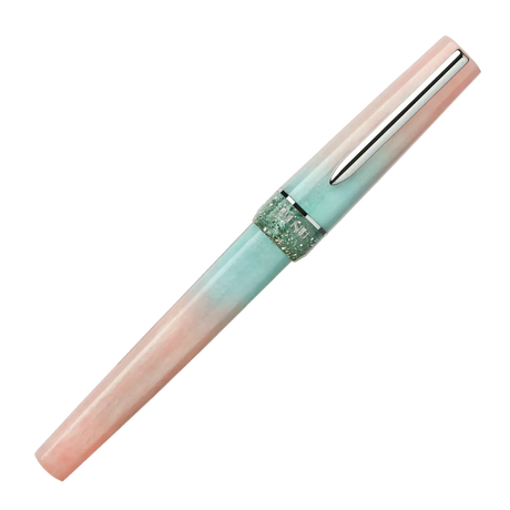 BENU presents the newest Haute Collection — a line of elegant, fashion-inspired pens that blend classic charm with bold, modern flair. The designs include both subtle and vibrant styles, showcasing BENU’s signature glitter and color artistry. Each pen features a faceted body with alternating wide and slender facets, complemented by either gold-plated or chrome-plated trims for a sleek, timeless look.

Soft shades of rose and mint melt together in Perle, accented by a sparkling band. As fresh as spring light