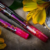 BENU Talisman Fountain Pen - Lily of the Incas

Adorning landscapes with its vibrant hues and captivating hearts with its rich history, the Lily of the Incas serves as the perfect inspiration for the namesake BENU creation.

Also known as Alstroemeria, this delicate marvel dates back to the Inca civilization, when it was revered as a divine gift from the Sun God. The Incas cherished its presence not only for its radiance but also for its believed otherworldly capabilities — from invisibility to the power of
