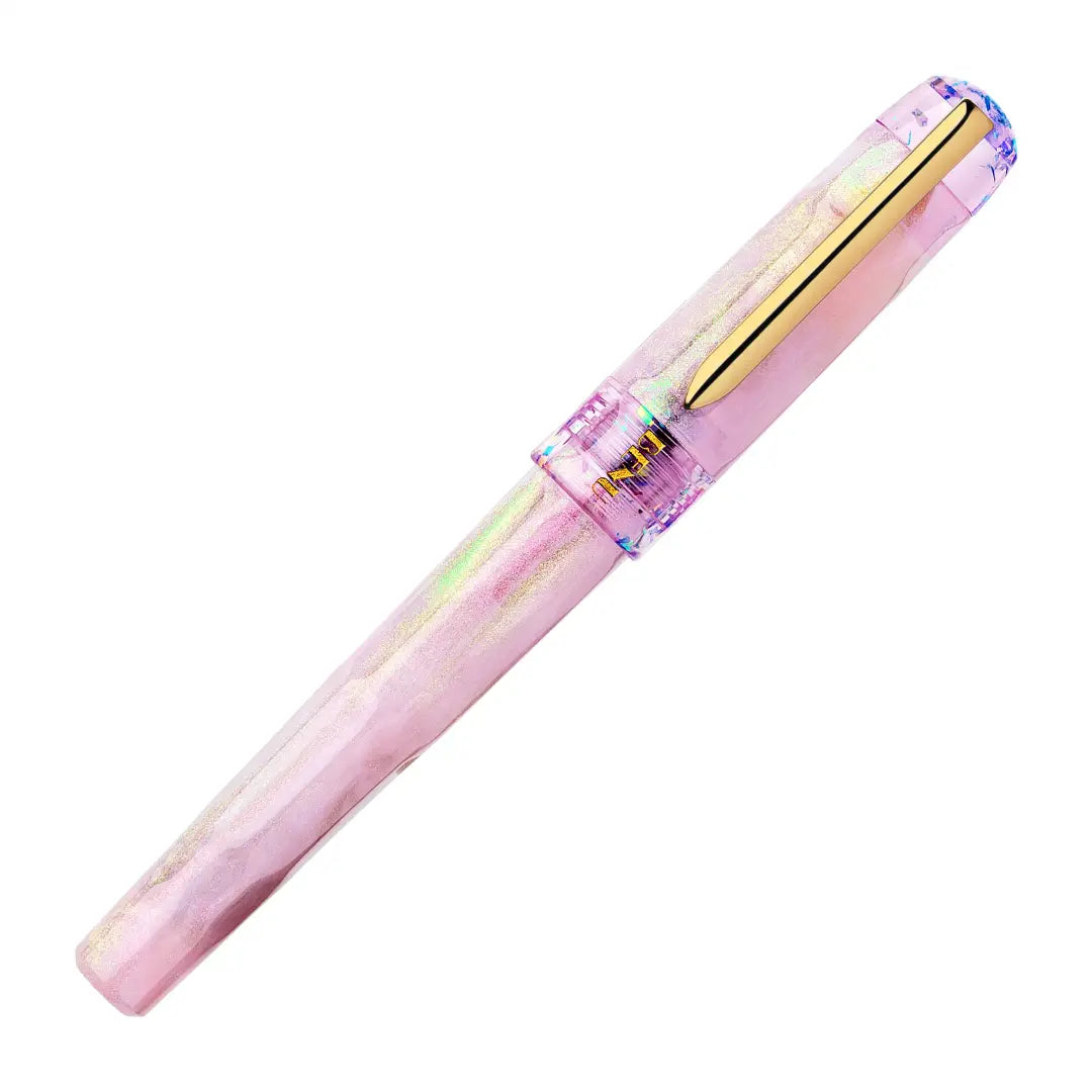 BENU Talisman Fountain Pen - Pink Opal

Inspired by the soft beauty and symbolism of the Pink Opal stone, Pink Opal joins BENU’s Talisman Collection — a series dedicated to legendary substances, natural materials, and symbols believed to carry meaning, protection, or good fortune across cultures and history.


The design captures the delicate character of pink opal through a palette that shifts between gentle cotton pink and soft lavender tones. Pronounced pearlescent effects and light-shifting properties c