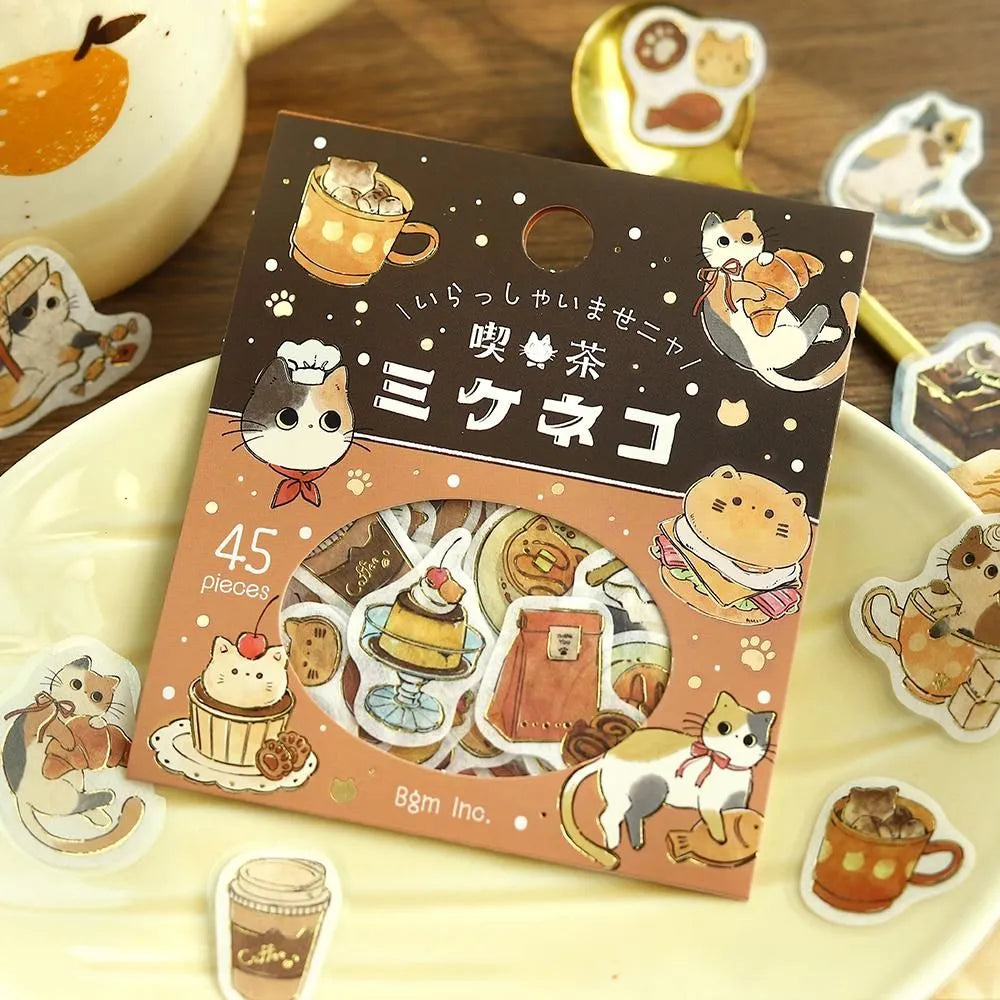 BGM - Welcome Meow! Series Café Mikeneko Sticker Flakes

The popular masking tape series "Cafe Kuroneko" has now become stickers!

Not only Kuroneko, but also Heineko, Mikeneko, and Shiro-Neko have joined the group. Each cat gathers here as a café with its own unique personality.
"Welcome, meow!"

Contents: 15 designs x 3 sheets
Material: Japanese paper
