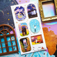 🌙⭐ Wanna get even further away? @9jedit’s got you covered with this stellar celestial set. Sometimes we can only escape in our daydreams and why would we want that to be ordinary? Think cozy reads under crescent moons, ferris wheel rides through cotton candy skies, and portals to worlds that aren’t planet earth. Take us away!

Art by: @9jedit

Top Coating: Gold foil

Adhesive Layer: PVC (plastic)

Backing Layer: Clear PET

6.69" x 3.54". Weight - 0.03lbs.

1 sheet included