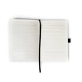 A premium soft-touch hardbound cover and smooth, lined pages make writing easy and enjoyable. The Smythe-sewn layflat binding keeps the notebook open for effortless note-taking, and the satin ribbon helps you mark your favorite pages.

New inside page design
Soft Touch Hardcover
5.75" x 8.25"
144 Lined Pages
Contrast Endpages
Bookmark, Pen Loop, &amp; Elastic Closure