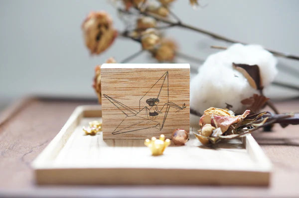 Black Milk Project - Paper Crane Rubber Stamp

Size: 4cm x 4.5cm

The stamps are made of industrial high grade red rubber with the finest details. As all stamps are assembled, cut, sanded by hand, size and shape may vary slightly. Wood material will differ depending on what the forest elves bring!

Stamps might be slightly stained because of quality tests during the process, but it will not affect your stamping color.&nbsp;