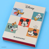 This Notebook Essentials Set includes 6 Blackwing pencils featuring Mickey Mouse, Minnie Mouse, Pluto, Goofy, Donald Duck, and Daisy Duck. It also includes a Mickey Mouse Pencil Sharpener, a Mickey Mouse Point Guard, and a medium Mickey & Minnie Mouse notebook with blank paper.