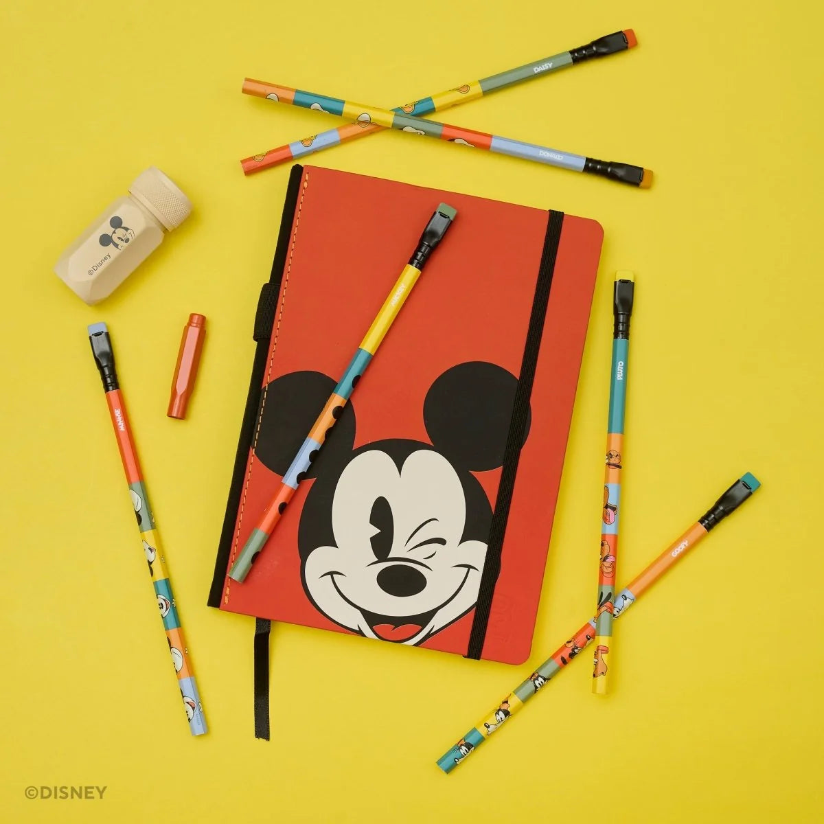 This Notebook Essentials Set includes 6 Blackwing pencils featuring Mickey Mouse, Minnie Mouse, Pluto, Goofy, Donald Duck, and Daisy Duck. It also includes a Mickey Mouse Pencil Sharpener, a Mickey Mouse Point Guard, and a medium Mickey & Minnie Mouse notebook with blank paper.