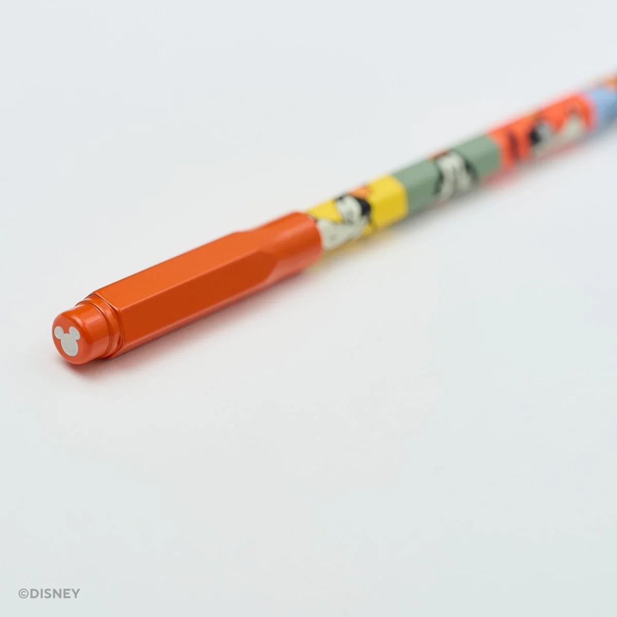 This red machined aluminum Point Guard is designed to make sure your Blackwing pencil stays sharp while you’re on the go. It features a silver Mickey Mouse emblem on the top. The tip of your pencil “floats” inside the cap to protect your point against unexpected drops or jams.