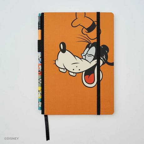 This medium notebook includes 160 pages of 100GSM blank paper and a matte hardcover featuring Goofy and Pluto. It also has a built-in pencil holster that comes loaded with a Goofy Blackwing pencil.