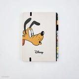 This medium notebook includes 160 pages of 100GSM blank paper and a matte hardcover featuring Goofy and Pluto. It also has a built-in pencil holster that comes loaded with a Goofy Blackwing pencil.