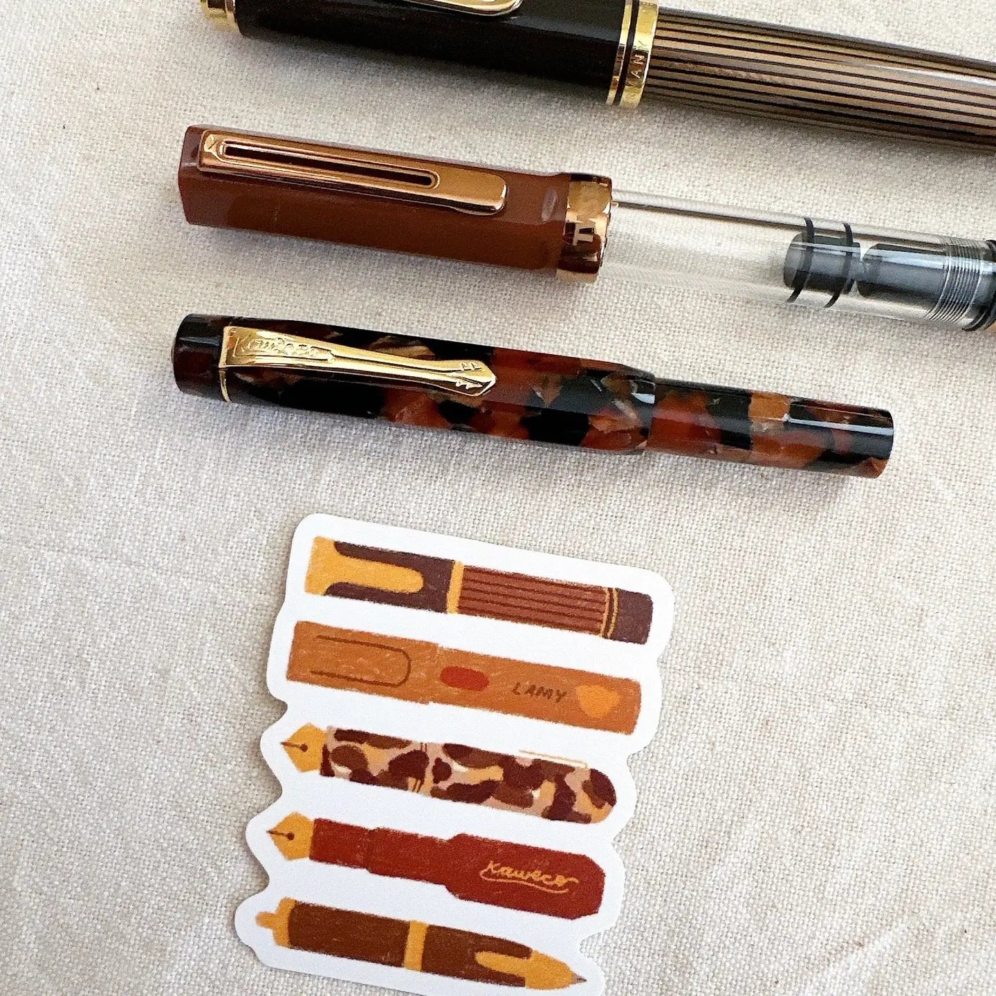 Bloom Paper Studio Die Cut Sticker - Bear's Pen Stack

These are a few of Bear's favorite pens that are currently inked! With brown ink of course! made with:

premium matte sticker paper
weatherproof - 2.4"x2.3"

Note: Colors on screen may appear slightly different on paper. By purchasing, you have acknowledged reading this disclaimer.

Includes 1 Sticker