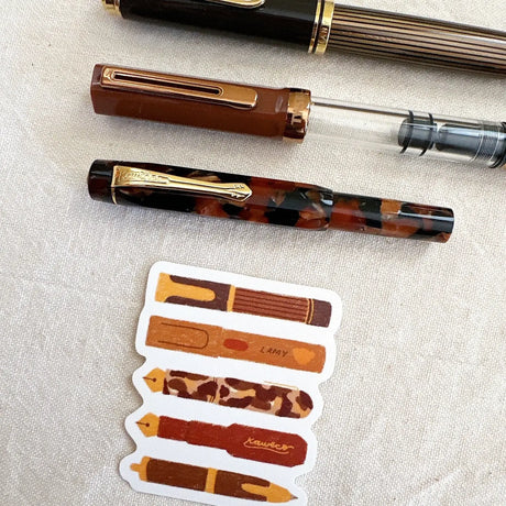 Bloom Paper Studio Die Cut Sticker - Bear's Pen Stack

These are a few of Bear's favorite pens that are currently inked! With brown ink of course! made with:

premium matte sticker paper
weatherproof - 2.4"x2.3"

Note: Colors on screen may appear slightly different on paper. By purchasing, you have acknowledged reading this disclaimer.

Includes 1 Sticker