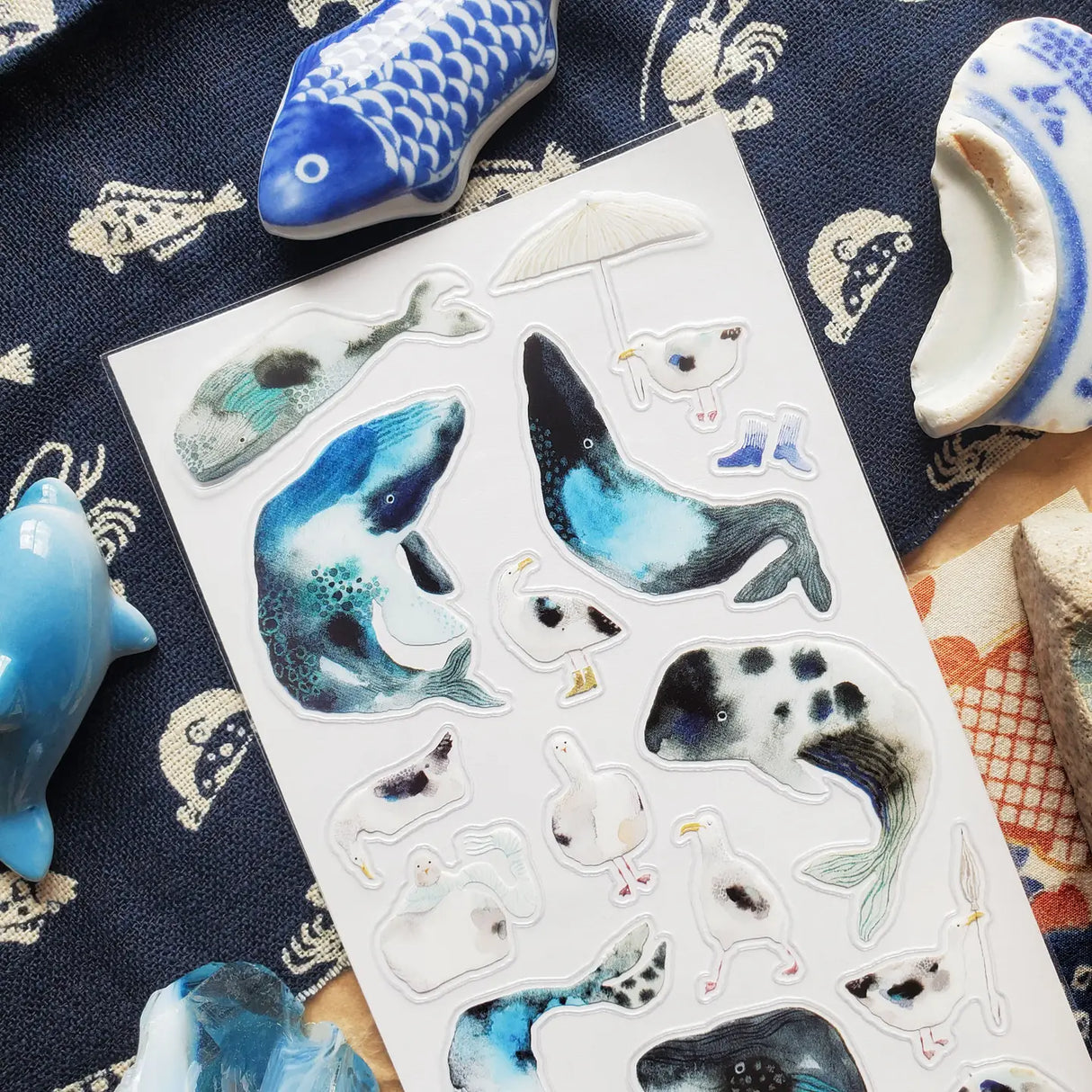 🐋☂️ Breezy and full of seaside charm, @martyna.czub’s watercolor whales and gulls make quite the charming coastal crew. With curious expressions, tiny umbrellas, rain boots, and a few delightfully dramatic whale poses, this playful sheet perfectly captures the magic of a windswept day by the sea.

Art by: @martyna.czub