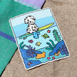 Bobbie Goods Vinyl Sticker - Underwater

Blue water in the middle is see-through!
Weatherproof
Gloss finish
3" x 3.7"