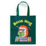 Oink-redibly cute and practical! Our Book Hog Reusable Shopping Bag is the perfect piggy companion for your shopping adventures. This adorable book-loving hog design turns errands into fun while helping you ditch single-use bags. Sturdy enough for groceries, books, or beach essentials, it folds up small when not in use. Shop sustainably with this playful porker that's always ready to carry your treasures!