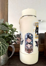 Bring the magic of storytime to life with our enchanting Mom and Kid Reading Sticker! Crafted with love and attention to detail, this holographic vinyl sticker captures a heartwarming scene of a mom and child engrossed in a book together that your customers will love!&nbsp;

Features: Size: 3.5 inches tall, 1.5 inches wide

Material: Premium vinyl with a captivating holographic finish