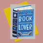 Embrace the power of words with our BOOK LOVER card from Daria Solak Illustrations. This card, folded to an A6 size, is a testament to the brand's dedication to creating designs that bring joy. Daria's London-based illustrations are hand-drawn, featuring vibrant colors and unique themes, including girls, animals, and food. Made with high-quality paper, watercolors, gouache, and colored pencils, this card embodies the brand's love for art and is sure to make any book lover smile.