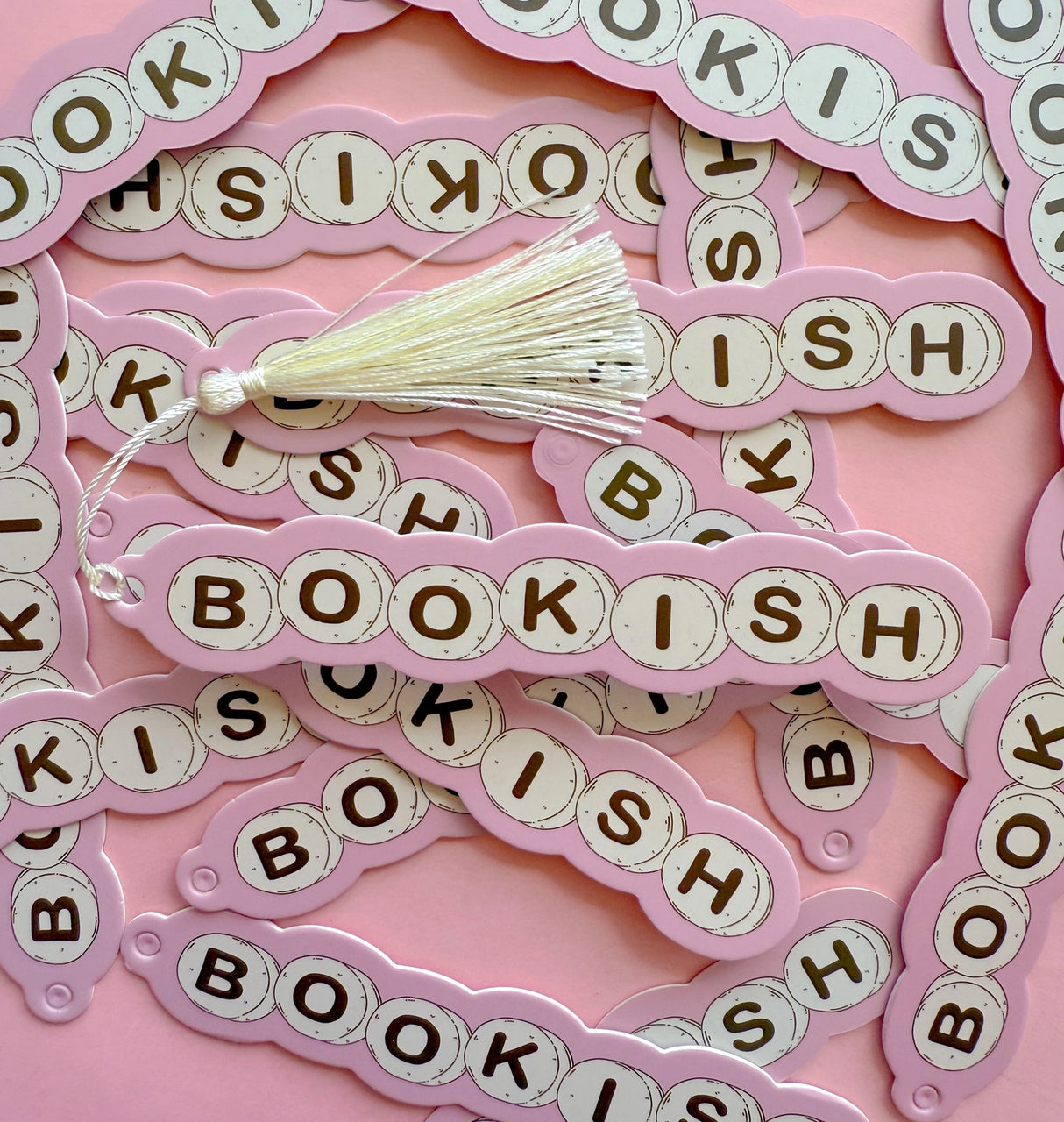 Made out of a heavy duty cardstock. Also double sided. Comes with an off white tassel.

Dimensions: 6inches long