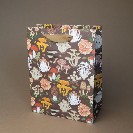 Botanica Paper Co. Medium Gift Bag - Mushrooms

Heavyweight uncoated paper stock&nbsp;
Printed in full color&nbsp;
Cotton ribbon handles
Cardboard floor insert&nbsp;
Size: 8" x 10.25" x 4.25"