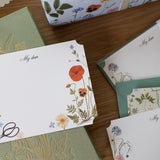 Botanica Paper Co. Herbarium A6 Notecards | Set of 4

Size A2, 5.5" x 4.25"
Pack of 4 writing cards + 4 A2 envelopes
Die-cut corners&nbsp;
Printed full color on heavyweight card stock
Illustrated pattern on the back