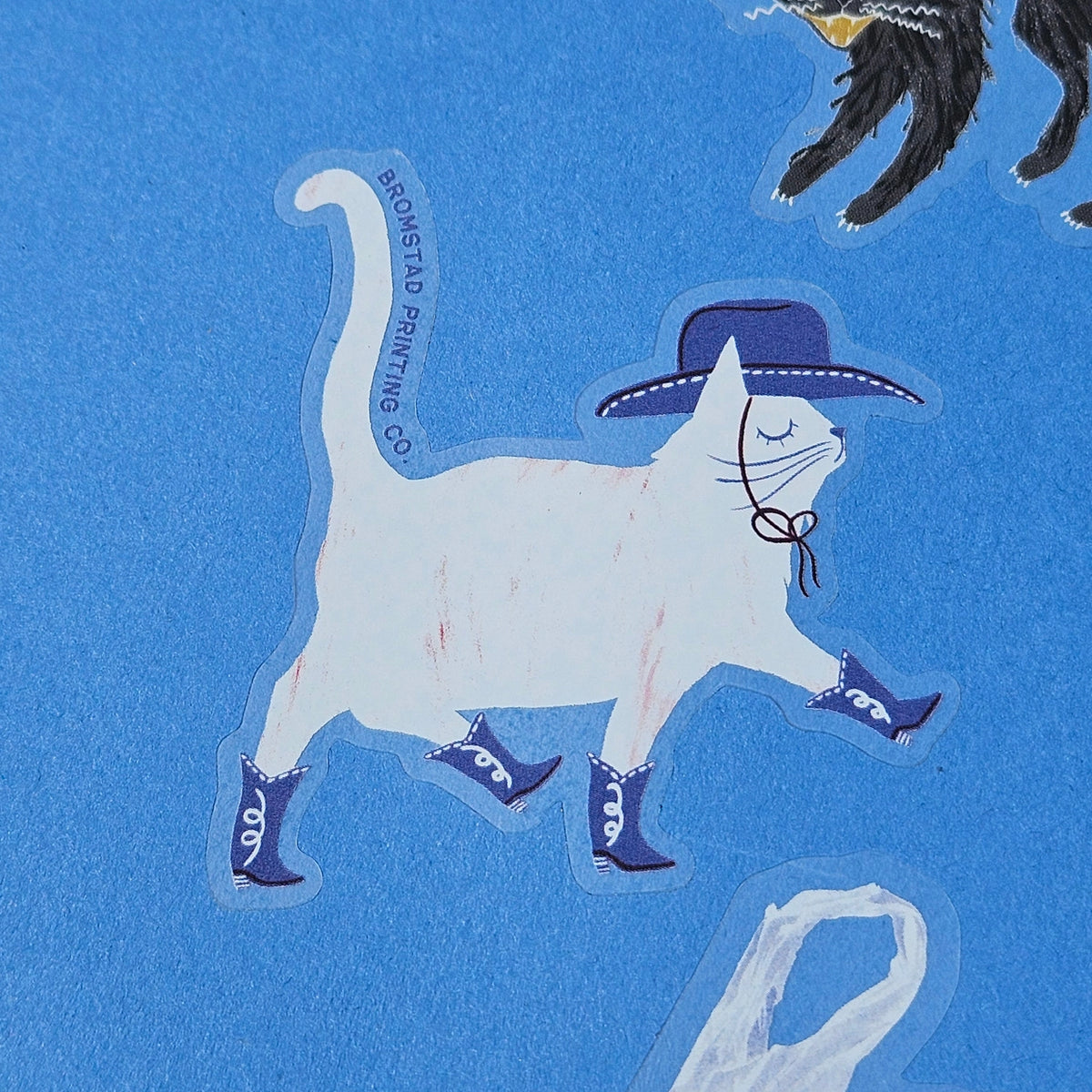 Yeehaw! Dust off your boots because Cowboy Cat is here! This 3" clear matte sticker is purrfect for adorning water bottles, laptops, and more.