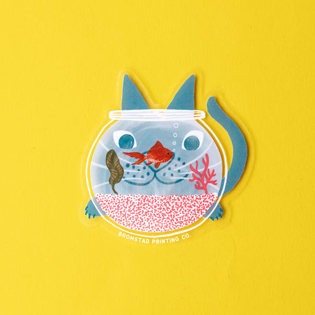 Hello there my fishy friend! A cat watches a goldfish intently, their face refracting goofily through the fishbowl. This 3" clear matte sticker is purrfect for adorning water bottles, laptops, and more. The white lines on the clear sticker pop on colorful backgrounds.