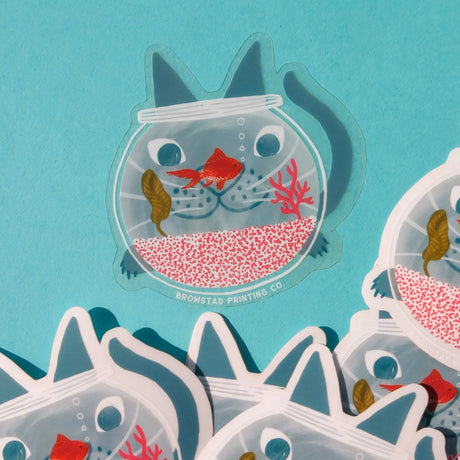Hello there my fishy friend! A cat watches a goldfish intently, their face refracting goofily through the fishbowl. This 3" clear matte sticker is purrfect for adorning water bottles, laptops, and more. The white lines on the clear sticker pop on colorful backgrounds.