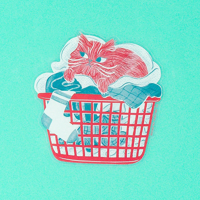 Is there anything cozier that curling up in a basket of warm laundry? This 3" clear sticker is purrfect for adorning water bottles, laptops, and more.