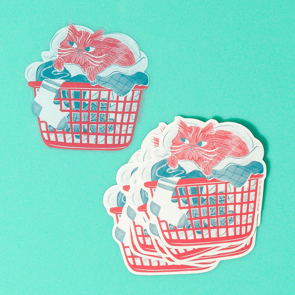 Is there anything cozier that curling up in a basket of warm laundry? This 3" clear sticker is purrfect for adorning water bottles, laptops, and more.