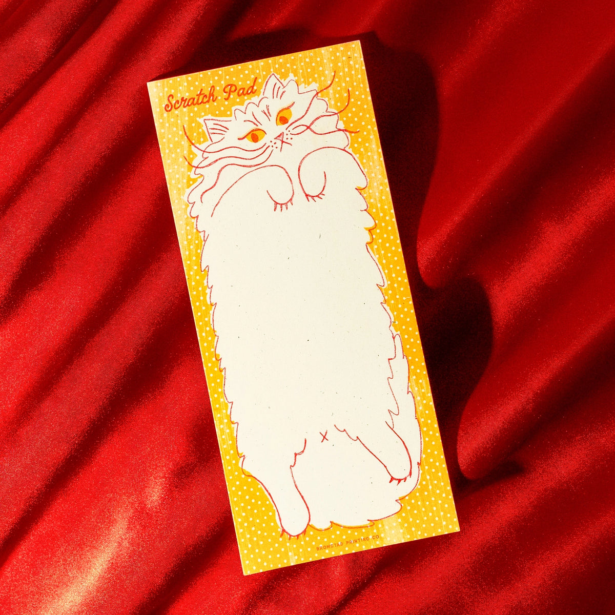 Beware the belly of this cat, you might get scratched as you scratch out your notes. Risograph printed in sunflower yellow and bright red with red glue on the top edge.