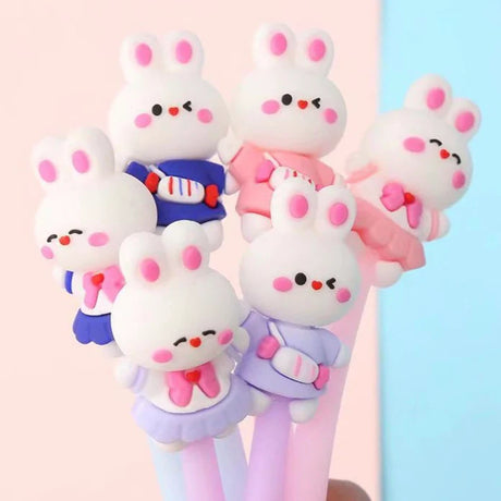 Bunny Wiggle Gel Pen Set of cute rabbit-shaped pens with colorful outfits on a pastel background