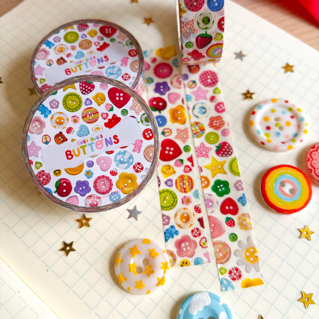 Add some color to your journal and crafts with this cute button themed washi tape designed by Veronica! This washi tape includes buttons hand-painted by Veronica and from her personal collection!

Perfect for crafts, journaling, snail mail, and more.

Size: 15mm x 10m