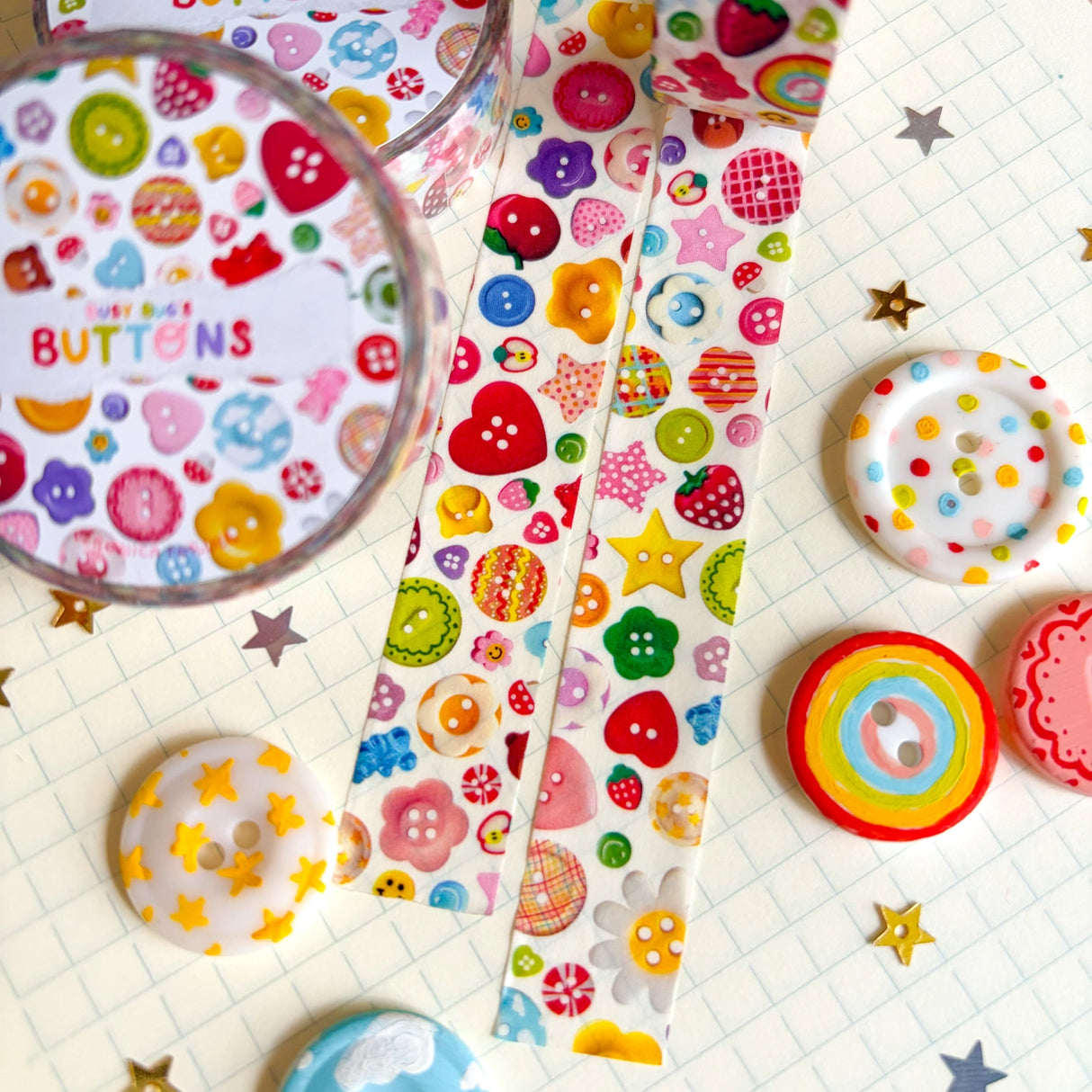 Add some color to your journal and crafts with this cute button themed washi tape designed by Veronica! This washi tape includes buttons hand-painted by Veronica and from her personal collection!

Perfect for crafts, journaling, snail mail, and more.

Size: 15mm x 10m