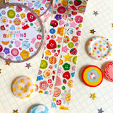 Add some color to your journal and crafts with this cute button themed washi tape designed by Veronica! This washi tape includes buttons hand-painted by Veronica and from her personal collection!

Perfect for crafts, journaling, snail mail, and more.

Size: 15mm x 10m