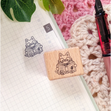 A small wood stamp of a little literary kitty for your planner and scrapbooking needs. Each stamp measures approximately 1 x 0.75 inch.

Stamps come loose and without any extra packaging.