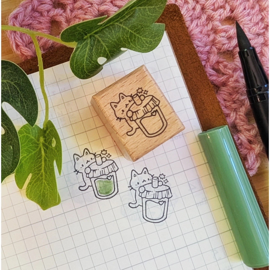 A small wood stamp of a little kitty enjoying a drink for your planner and scrapbooking needs. Each stamp measures approximately 1 x 0.75 inch.