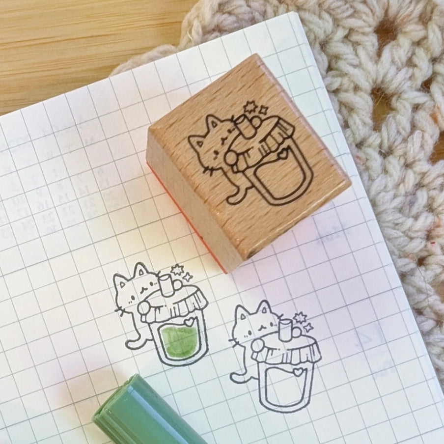 A small wood stamp of a little kitty enjoying a drink for your planner and scrapbooking needs. Each stamp measures approximately 1 x 0.75 inch.
