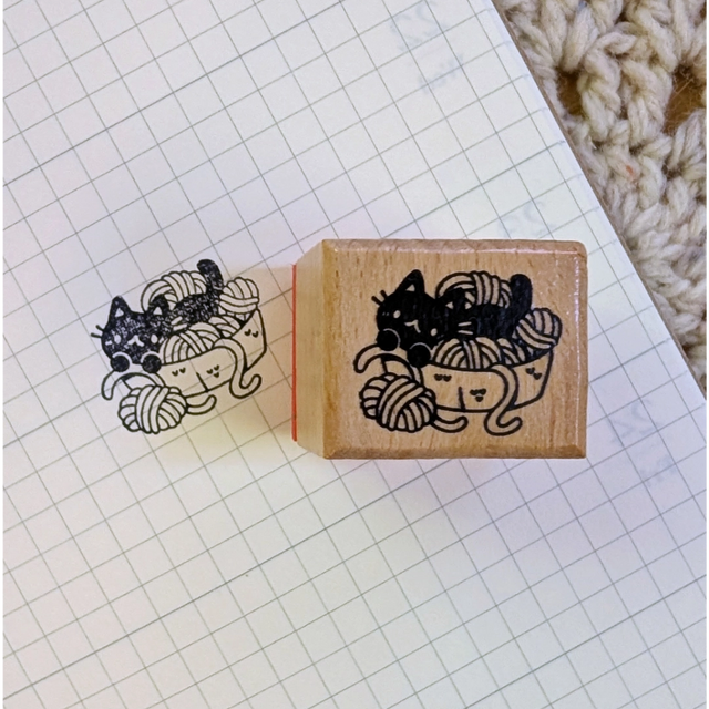 A small wood stamp of a little kitty with their yarn collection for your planner and scrapbooking needs. Each stamp measures approximately 1 x 0.75 inch.