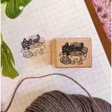 A small wood stamp of a little kitty with their yarn collection for your planner and scrapbooking needs. Each stamp measures approximately 1 x 0.75 inch.
