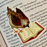 Cute little bird thoroughly engrossed by a very good book. Perfect clear sticker for any book lover.