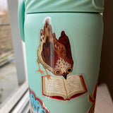 Cute little bird thoroughly engrossed by a very good book. Perfect clear sticker for any book lover.