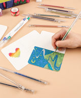 Unleash your creativity and add a touch of sparkle to your artistic endeavors with Grabie Glitter Gel Pens. With a stunning array of 18 vibrant colors packed with shimmering glitter, these pens ignite the imagination with brilliant shades of the rainbow.

COLOR-CHANGING GLITTER INK -&nbsp;The advanced glitter technology shifts hues based on the ink color, showcasing a stunning chameleon effect when exposed to sunlight.