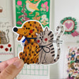 Presenting the CAT&amp;DOG sticker from Daria Solak Illustrations, a must-have for all pet lovers! This sticker, boasting a size of 8 cm, beautifully encapsulates the charm and playfulness of our beloved furry friends. Each design is a product of Daria Solak's meticulous hand-drawn illustrations, promising a unique, artistic flair. Perfect for personalizing your notebooks, gadgets, and more. Enjoy the joy of creativity with this adorable sticker!