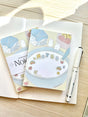 Chocolett - Cereal Memo-Pad

This memopad comes with 50 thick pages and measures 5.5 x 4 inches big. It’s cutely decorated with a little breakfast cereal scene and tiny bunnies.

Please note that these are not sticky notes.