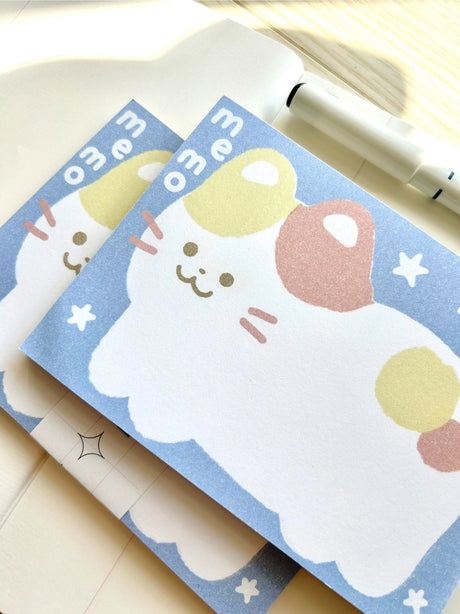 Chocolett - Kitty Memo Pad

This memopad comes with 50 thick pages and measures 5.5 x 4 inches big. It’s cutely decorated with a giant kitty for all your notes and memos.

Please note that these are not sticky notes.

Includes 1 memo pad